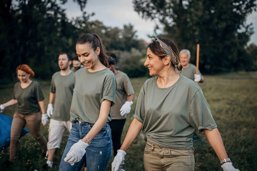Group of volunteers walking through grass