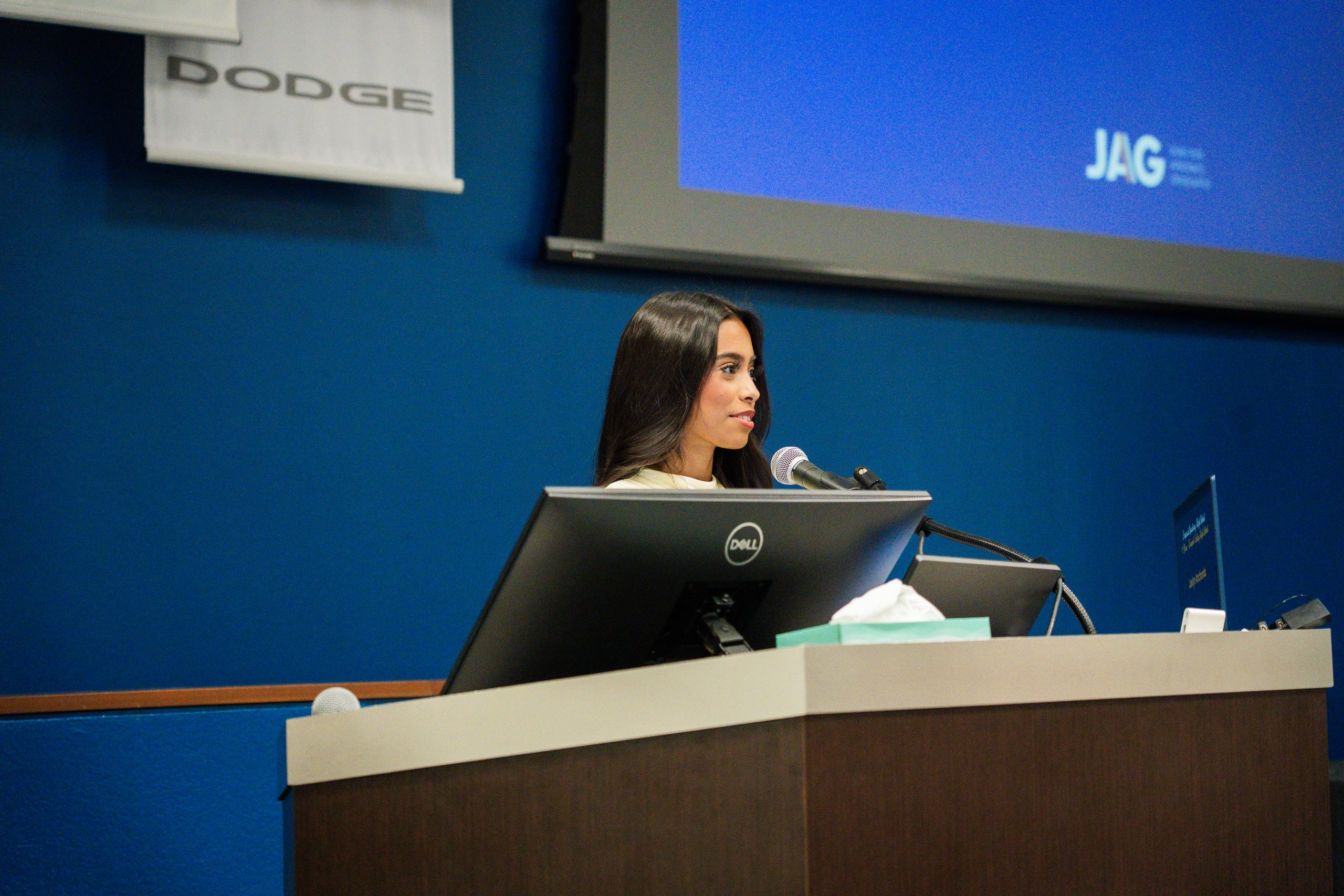 Young woman who faced adversity gives a speech at award ceremony