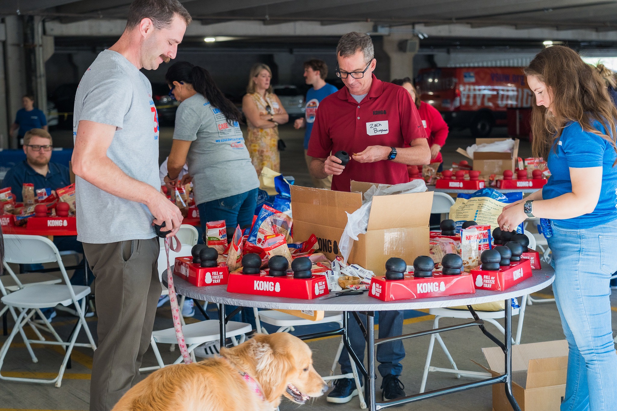 Volunteers and dog at a PetSmart's 'Be the Difference' employee engagement event.