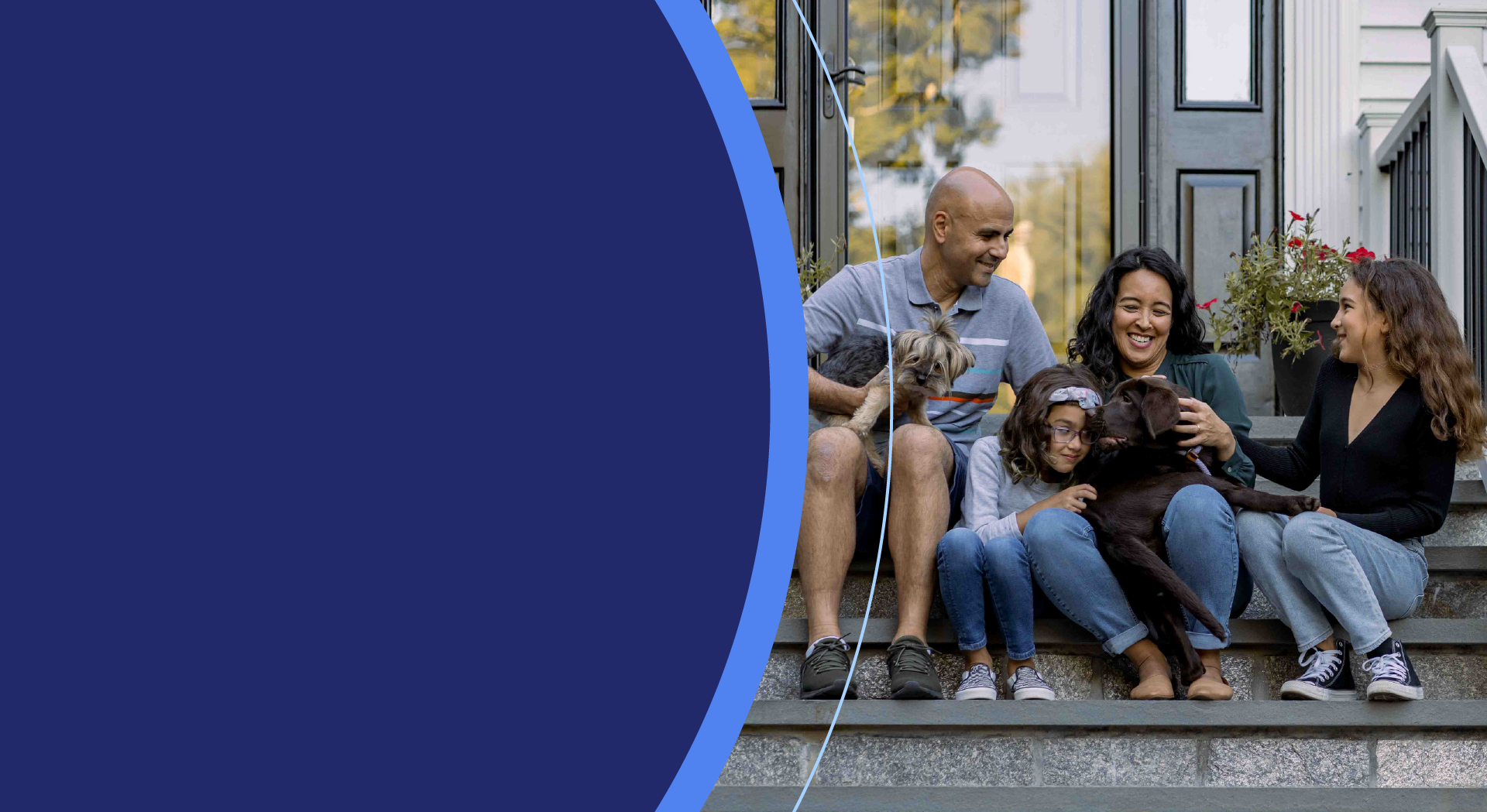 family and family pets sitting on a porch stoop